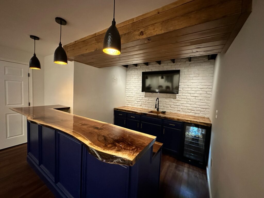 raw edge wood counter with pendant lights above