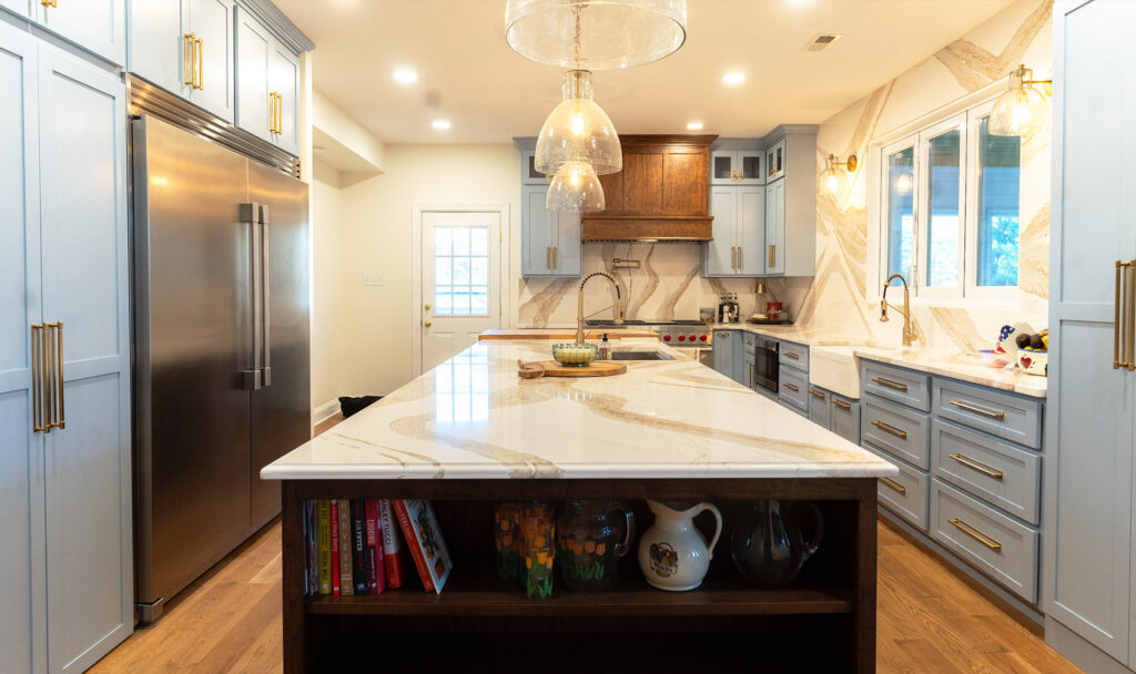 large kitchen island with shelves displaying cookbooks